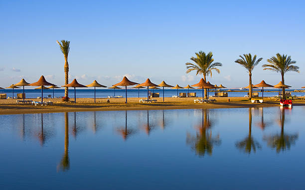 Straw umbrella on the beach. Hurghada, Egypt.